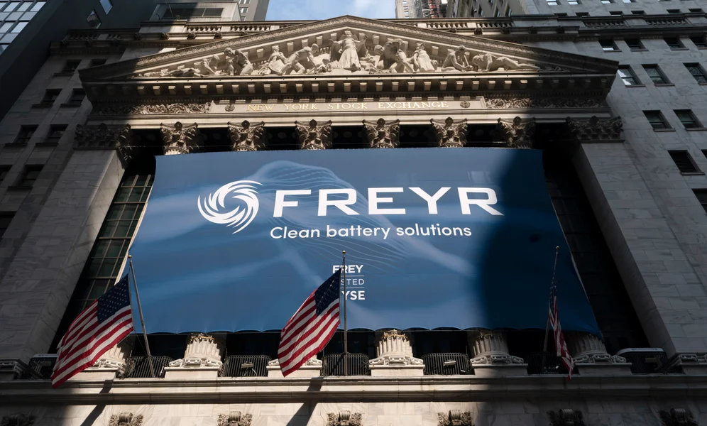 File - A banner for Norway's battery cell startup Freyr hangs on the facade of the New York Stock Exchange to mark the company listing, Thursday, July 8, 2021. Freyr is planning its next factory in an Atlanta suburb because a new U.S. clean energy law offers generous tax credits for local production. (AP Photo/Mark Lennihan, File)