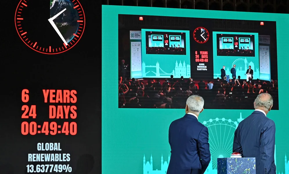 Britain's King Charles III, right, looks on with London Mayor Sadiq Khan after Khan activated the 'Climate Clock', an indicator that will highlight the predication that there are just over 6 years to act in order to limit global warming to 1.5 degrees, according to data from the IPCC and MCC, during the Climate Innovation Forum at the Guildhall in London, Wednesday, June 28, 2023. The Climate Innovation Forum aims to bring together leaders from government, business, finance, and civil society to encourage collaboration and innovation towards meeting global climate goals. (Justin Tallis/Pool Photo via AP)