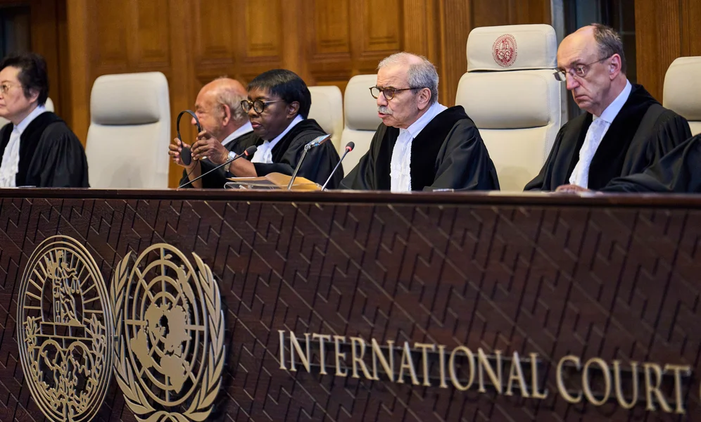 Presiding Judge Nawaf Salam reads the ruling in the International Court of Justice, or World Court, in The Hague, Netherlands, Friday July 19, 2024, as the United Nations top court is delivering a nonbinding advisory opinion Friday on the legality of Israel's 57-year occupation of lands sought for a Palestinian state, a ruling that could have more effect on international opinion than it will on Israeli policies. (AP Photo/Phil Nijhuis)