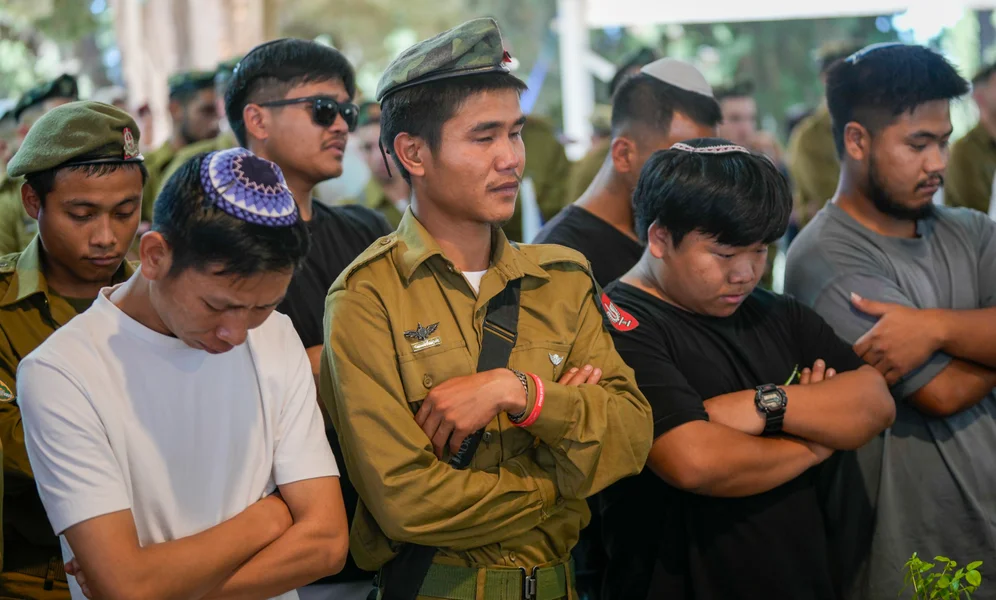 Israeli soldiers and friends mourn during the funeral of first sergeant Geri Gideon Hanghal at the Mount Herzl military cemetery in Jerusalem, Thursday, Sept. 12, 2024. (AP Photo/Ohad Zwigenberg)