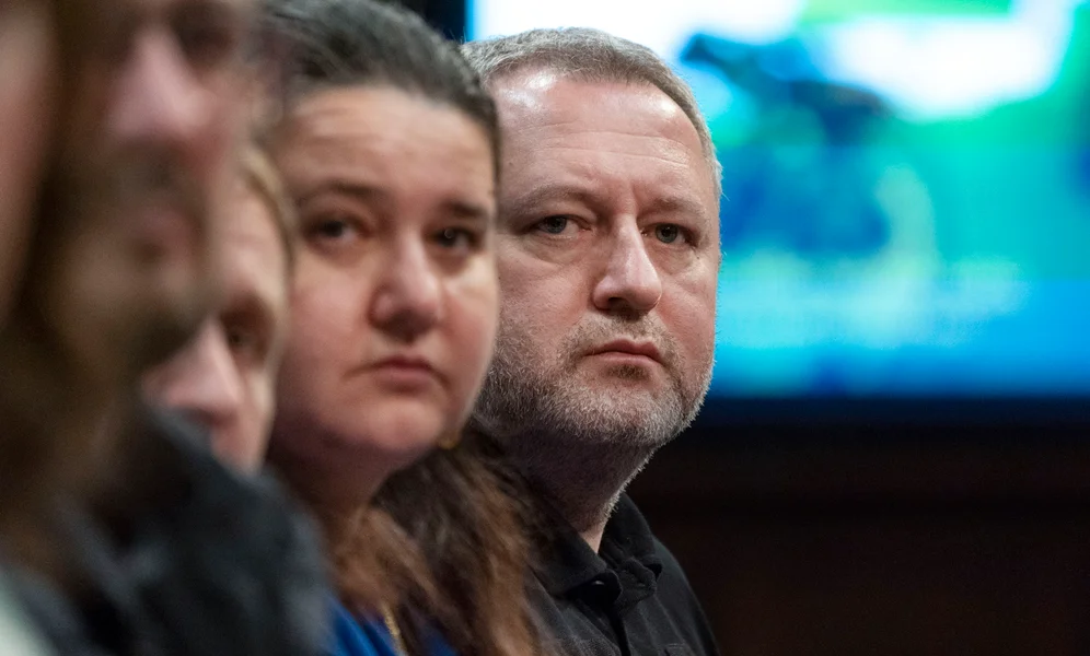 Ukraine's Ambassador Oksana Markarova, left, and Ukrainian Prosecutor General Andriy Kostin, watch a video during a House Foreign Affairs Committee hearing, Wednesday, April 19, 2023, on Capitol Hill in Washington. Ukraine's top prosecutor described for U.S. lawmakers on Wednesday horrifying examples of atrocities that he says are deliberately orchestrated by Russian forces to sow fear and terror among civilians. (AP Photo/Jacquelyn Martin)