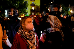 Activist Greta Thunberg, left, attends a pro-Palestinian rally in Berlin, Monday, Oct. 7, 2024. (AP Photo/Ebrahim Noroozi)